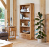 Image of the Baumhaus Mobel Oak Large 3-Drawer Bookcase (COR01A) in a living room setting