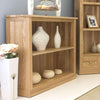 Image of the Baumhaus Mobel Oak Low Bookcase (COR01B) with ornaments
